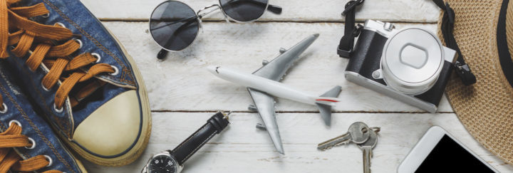 Top View Women Accessoires To Travel Concept White Mobile Phone Airplane Hat Passport Watch Sunglasses On Wood Table Top View Women Accessoires To Travel Concept White Mobile Phone Airplane Hat Passport Watch Sunglasses On Wood Table